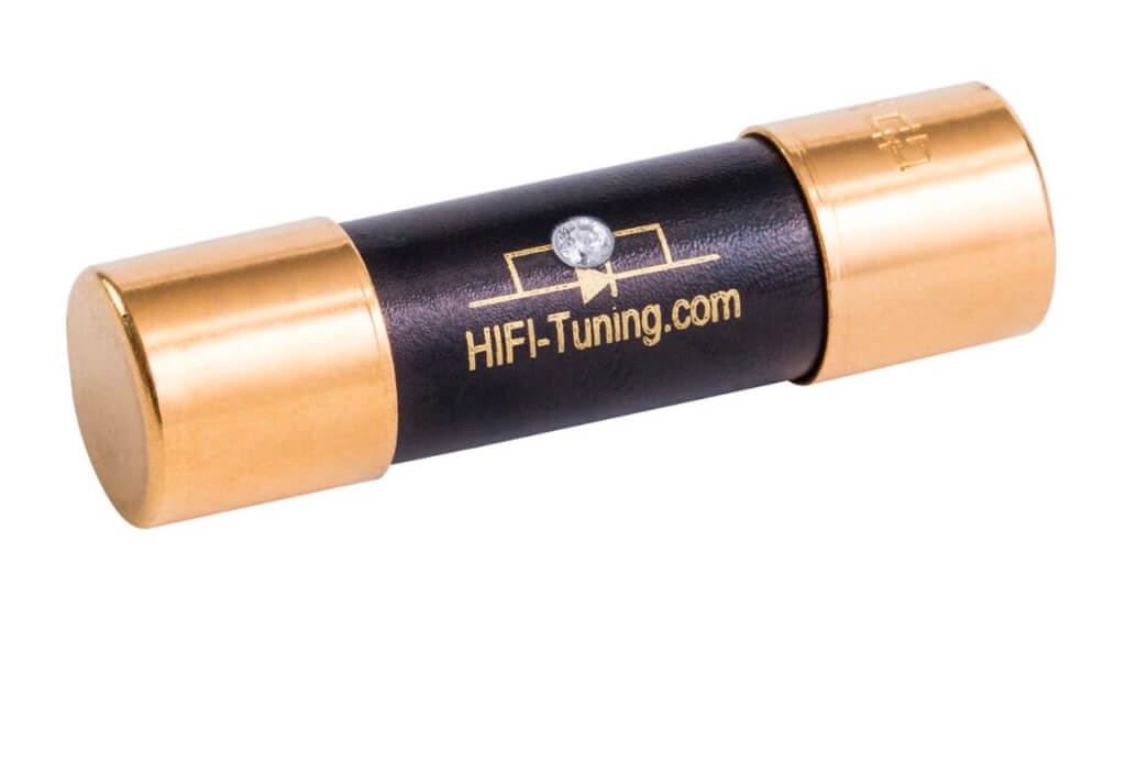 HiFi‑Tuning Supreme³ Diamond fuse with gold-plated end caps, black ceramic body, and central diamond inlay, handmade in Germany for high-end audio systems. 